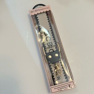 BCBGeneration Rose Pink adjustable crossbody strap for mobile phone.